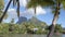 Travel vacation establishing shot. Bora Bora and Mount Otemanu in Tahiti, French Polynesia, palm trees coral lagoon sea