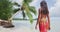 Travel woman walking on paradise beach on holidays vacation on Bora Bora