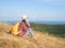 Travel , Women wearing Blue jeans and red plaid shirt and backpacking yellow at viewpoint on mountain are looking at the sea