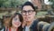 Traveler Asian couple using smartphone taking selfie while spending holiday trip at Ayutthaya, Thailand, Couple enjoy their