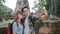 Traveler Asian couple using smartphone taking selfie while spending holiday trip at Ayutthaya, Thailand, Couple enjoy their