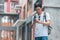 Traveler Asian man direction on location map in Beijing, China, backpacker male using mobile phone looking on map find landmark