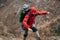 Traveler bearded male trekking and mountaineering during his journey. Extreme young man hiking in mountains