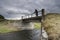 Traveler on a bridge near Gluggafoss waterfall