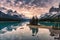 Traveler canoeing with rocky mountain reflection on Maligne lake at Spirit island in Jasper national park