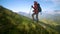 Traveler Caucasian woman walks along the narrow ridge of the peak at sunset. Reaching the top. Young woman practicing a