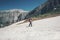 Traveler climbing on mountains glacier with backpack