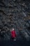 Traveler exploring Black sand Reynisfjara Beach in Iceland