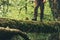 Traveler Feet hiking crossing river on woods