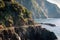 Traveler footpath over water on rocks of Cinque Terre national park near Vernazza town in Italy