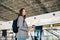 Traveler girl at the departure zone at the airport.