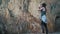 Traveler girl make photos, exploration a devetashka cave near lovech