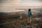 Traveler girl standing on peak of mountain