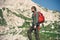 Traveler Man bearded with backpack mountaineering