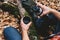 Traveler man pours tea from thermos outdoor