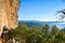 Traveler Man relaxing meditation with serene view of mountains. Travel Lifestyle hiking concept summer vacations outdoor. Spain