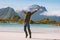 Traveler man tourist hands raised enjoying Norway landscape active healthy lifestyle