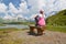 Traveler at a mountain lake