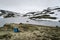 Traveler near mountain lake in Norway,Aurlandsfjellet scenic route