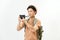 Traveler and photographer. Studio portrait of handsome young man holding photocamera taking photo