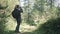 Traveler photographing scenic view in forest. One caucasian woman shooting nice magic look. Girl take photo video on