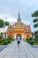 Traveler selfie and take a photo two statue giant at churches Wat Arun, Bangkok, Thailand