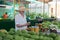 Traveler shopping on traditional Victoria food market, Seychelles.