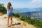 Traveler smartphone, landscape photography. Attractive girl takes story on smartphone while traveling mountains in Montenegro.