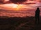 Traveler stand on Rocky cilff with sunsire sky and beautiful cloud sea on `Pa na rai ` Khao Luang mountian