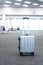 traveler suitcases in airport terminal