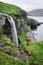 Traveler takes selfie near Skardsafossur waterfall, Vagar island, Faroe Islands