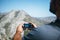 Traveler taking photograph of mountains