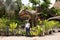 Traveler thai women travel visit at Dinosaur model in Sirindhorn Museum and Phu Kum Khao Dinosaur Excavation Site at Sahatsakhan