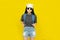 Traveler tourist beautiful young asian woman in casual clothes and sunglasses with Backpack isolated on yellow background.Summer