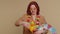 Traveler tourist young redhead woman celebrating, dancing fooling with swimming inflatable duck toy