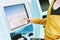 Traveler using a self check-in machine kiosk service at airport.