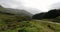 Traveler walk against beautiful Scotland nature. 4K Footage.