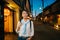 Traveler walking in the quiet street at night