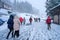 traveler walking on snow covered road in shirakawago winter at Japan