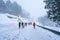 Traveler walking on snow covered road in shirakawago winter at Japan