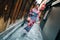 Traveler wearing colorful kimono walking in alley