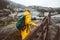 Traveler woman climbing up stairs in rocky mountains