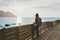 Traveler woman contemplating standing alone on bridge