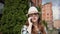 Traveler woman with hat talking on the phone in the city, talking with friends