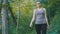 Traveler woman hiking on the forest trail path in mountain. walking on rocks