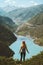 Traveler woman hiking solo enjoying lake aerial view travel adventure