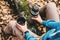 Traveler woman holding a cup of tea and thermos in autumn forest