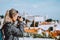 Traveler woman make a picture of Lisbon cityscape. The National Pantheon and the towels of Vicente de Fora come into