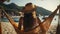 Traveler Woman Swinging in Beach Hammock