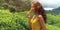 Traveler Woman With Tea Leaf in Hand During Her Travel to Famous Nature Landmark Tea Plantations